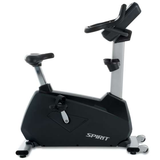 "SPIRIT stationary exercise bike with black and silver frame, padded seat, handlebars, and cup holder attached below the console